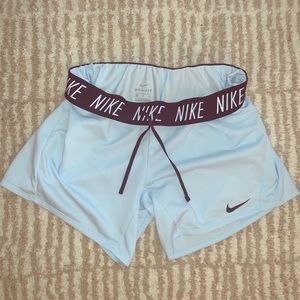 NIKE light blue dri-fit roll up shorts